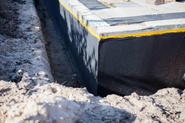 Professional Emergency Waterproofing technician working in Farmland, IN